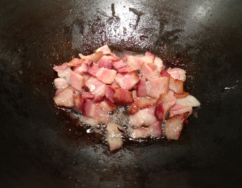Bacon sizzling in Wok