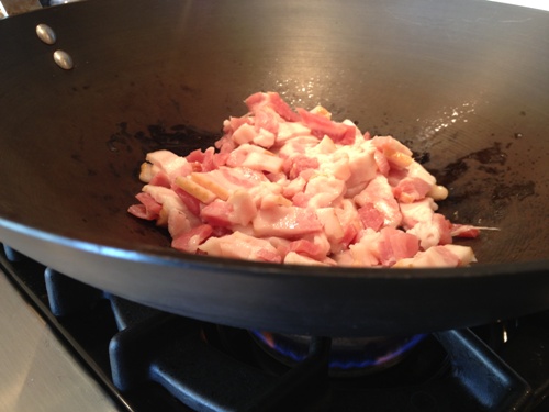 Poke bacon in wok